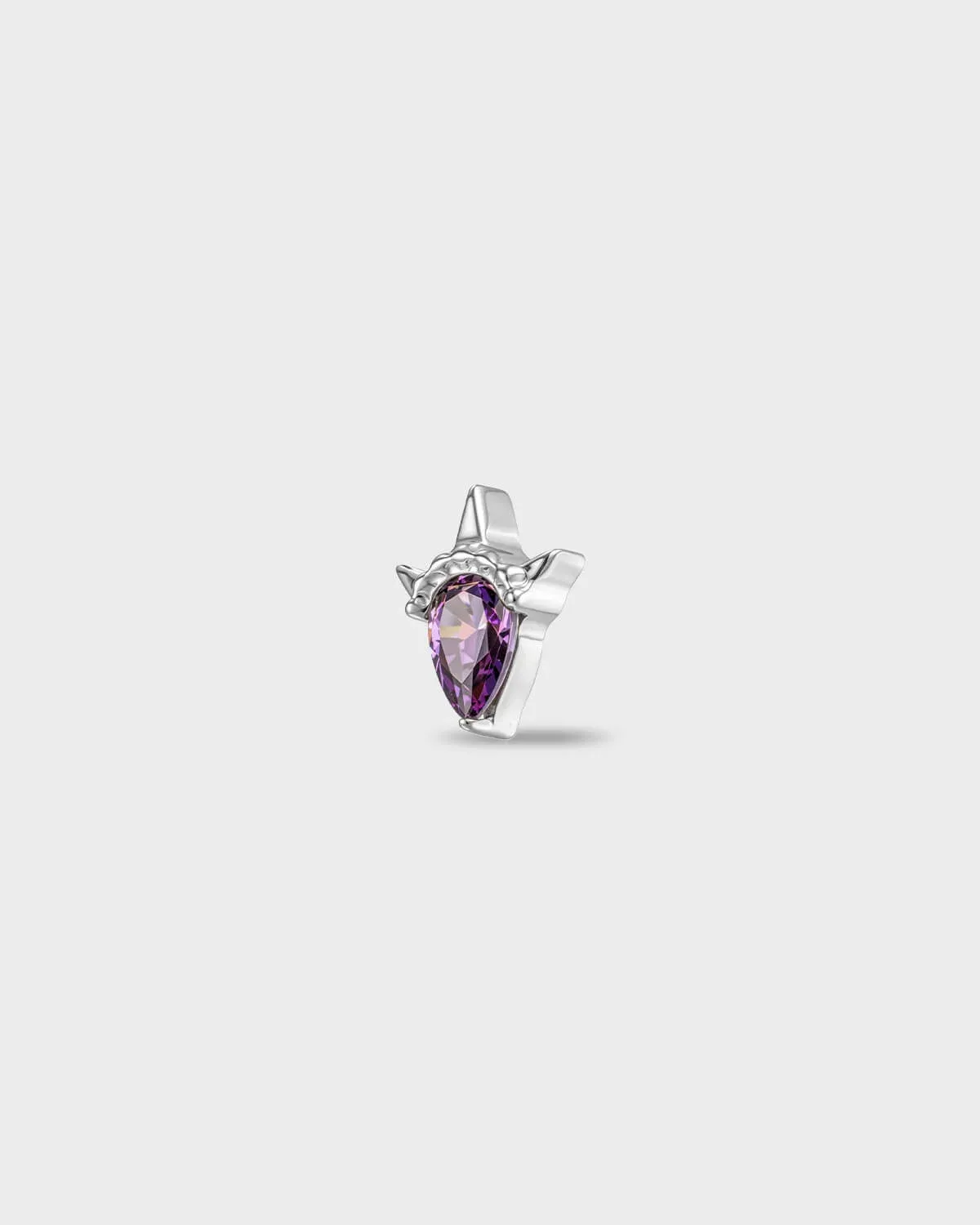 Polished titanium earring with a pear-cut amathyst purple stone set in a sculpted, pointed setting, on a light gray backgroud.