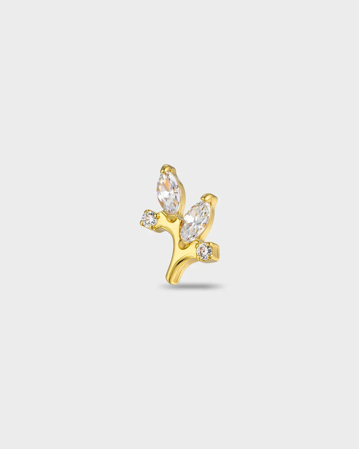 Gold titanium earring with two marquise-cut clear stones and two smaller round-cut clear stones set on a curved base on a light gray background.