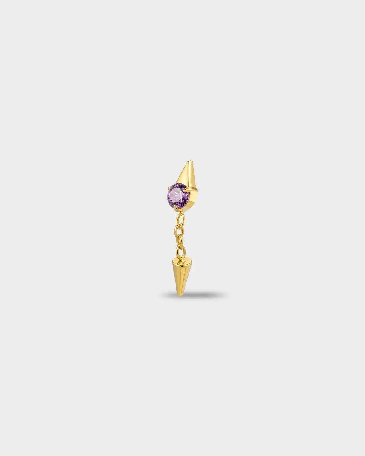 Gold titanium earring with a round-cut amethyst purple stone and a short chain dangle finished with a polished spike, on a light gray background.