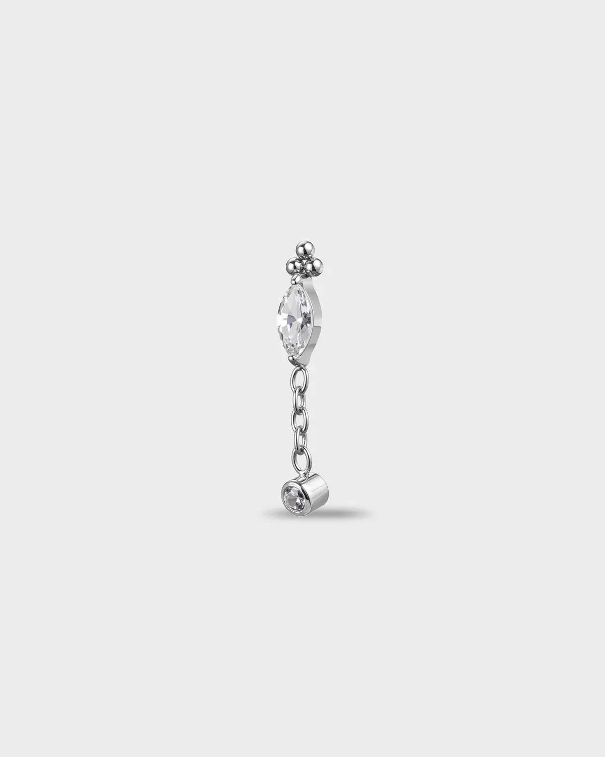 Polished titanium earring with a marquise-cut clear stone, a short chain dangle, and a small round-cut clear stone in a bezel setting, on a light gray background.