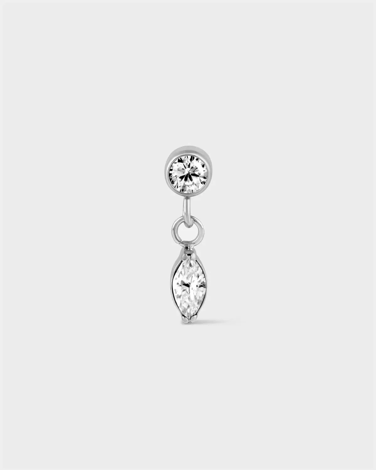 Polished titanium solitaire earring with marquise drop on a light grey background.