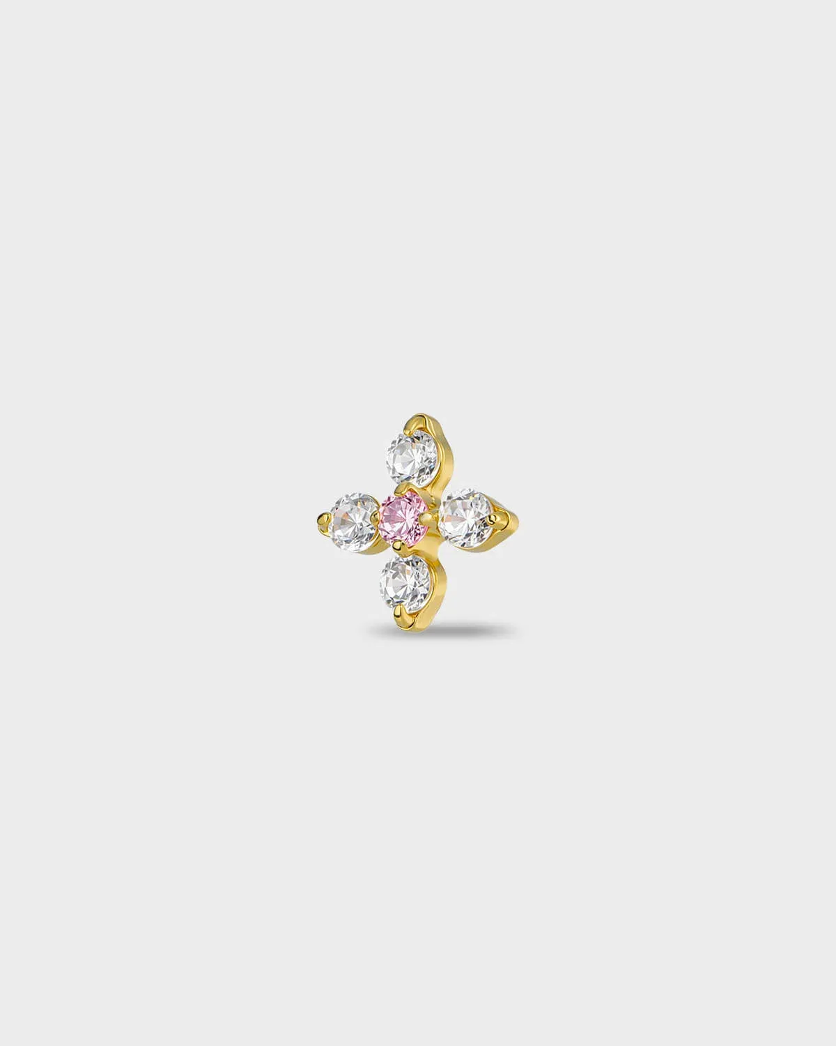 Gold titanium earring with four round-cut clear stones set around a single round-cut pale pink stone, on a light gray background.