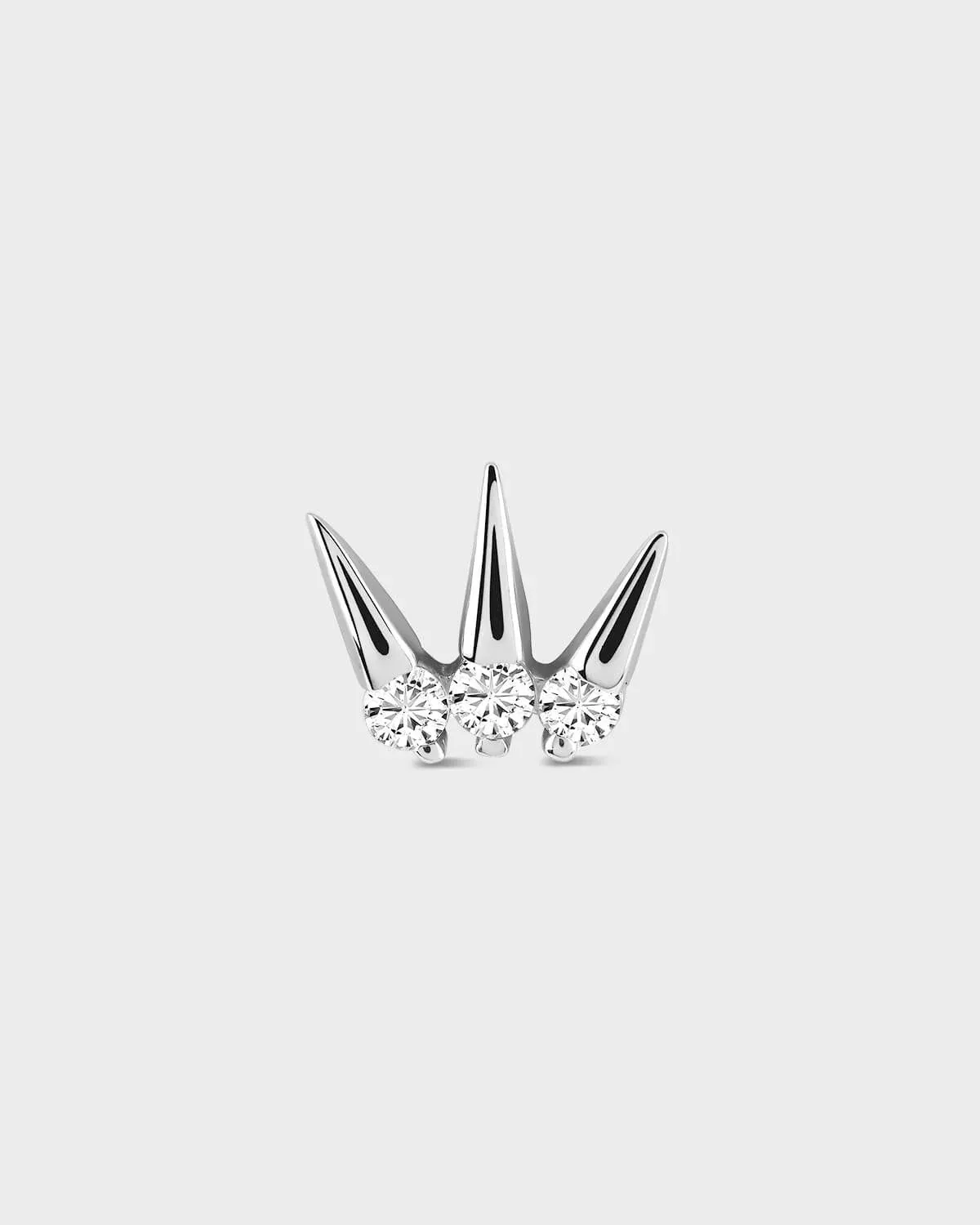 Silver crown-shaped earrings with clear gemstones on a light gray background