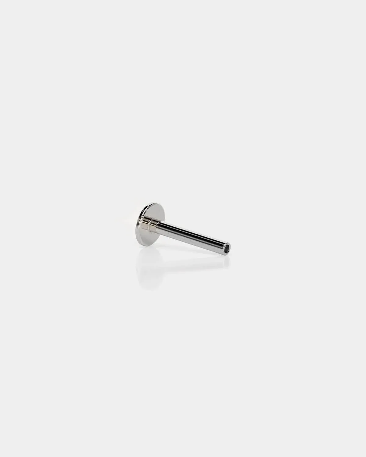 Threadless titanium labret back in polished silver with a 4mm base and 16g shaft on a light gray background