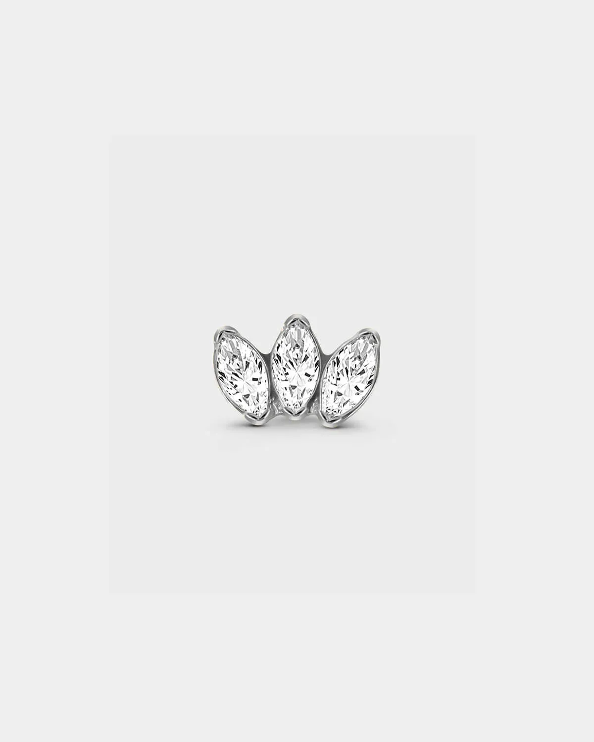 Polished silver titanium threadless earring with three bezel set clear marquise gemstone in a slight fan shape in a light grey background.