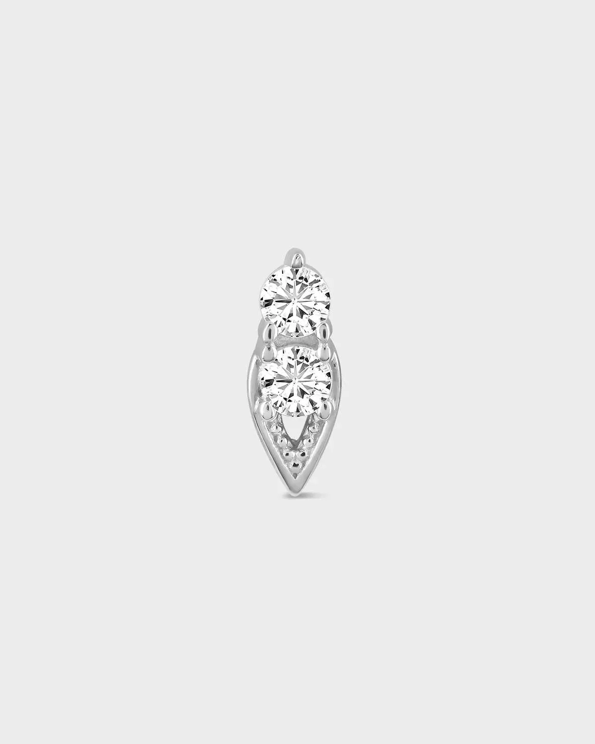 Diamond earring on a light gray background