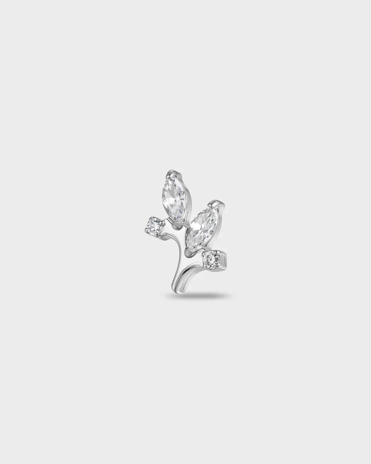 Polished silver titanium earring with two marquise-cut clear stones and two smaller round-cut clear stones set on a curved base on a light gray background.