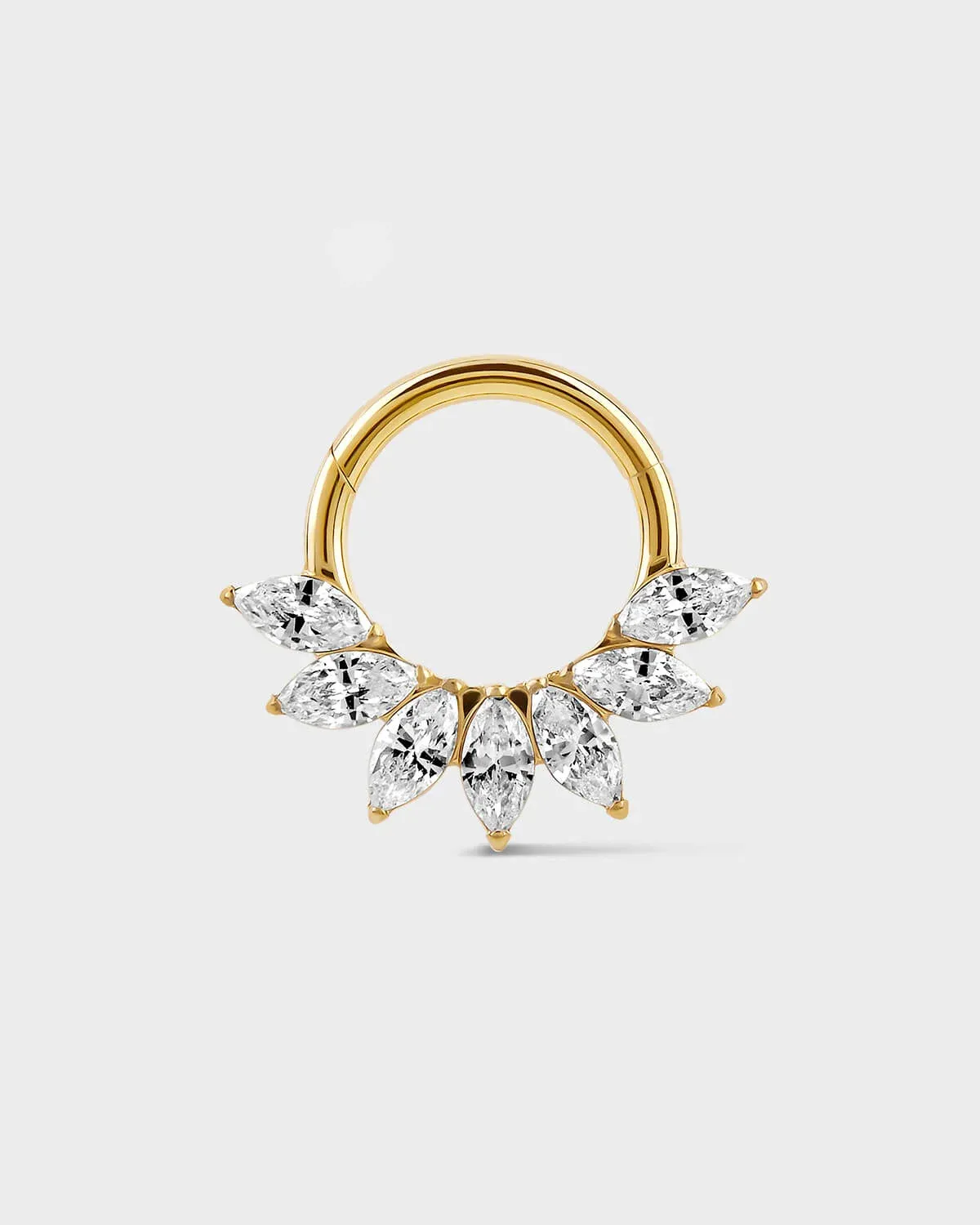 Daith Septum ring in gold titanium with seven marquise gemstone in a fan formation on a light gray background