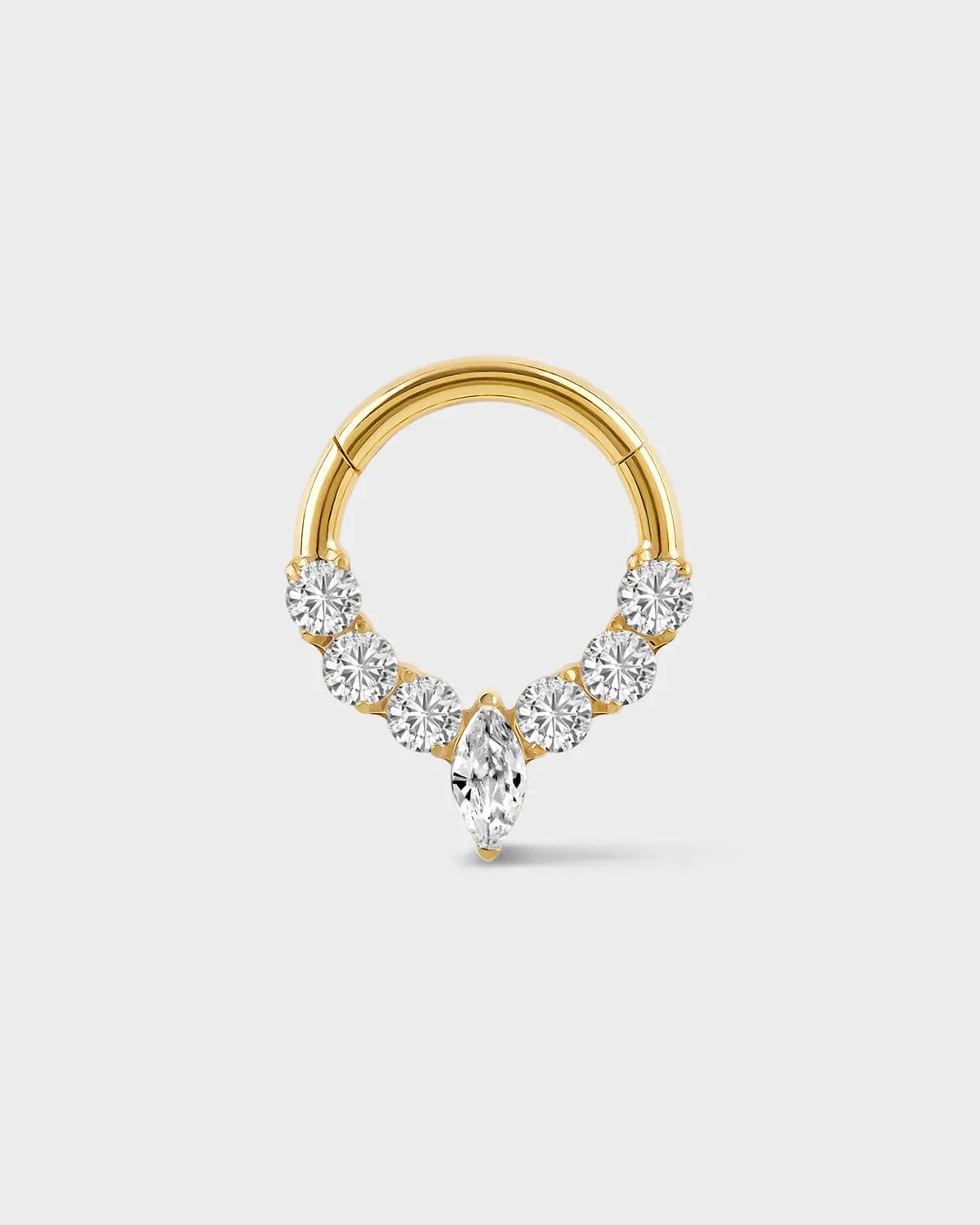 Gold daith ring with central marquise gemstone and three gem either side on a light gray background