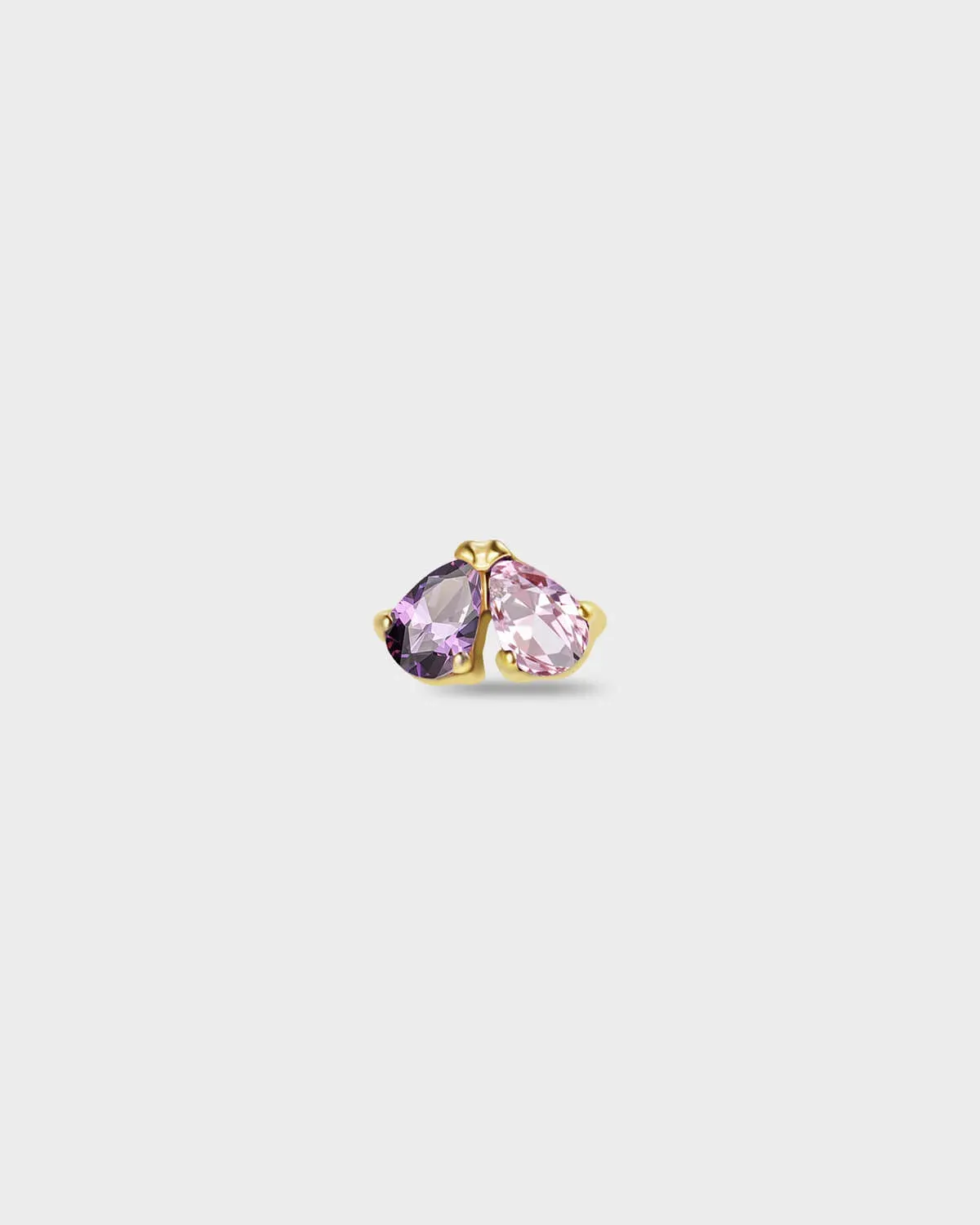 Gold titanium earring with two pear-cut stones set side by side, one purple and one pale pink on a light gray background.