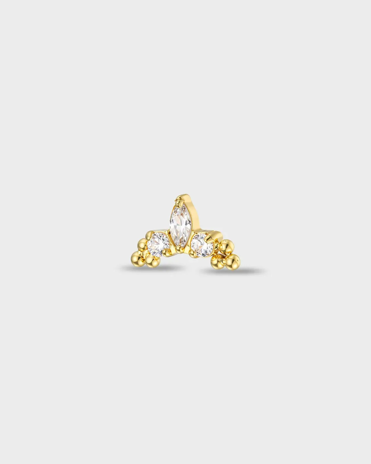 Gold titanium earring with a marquise-cut clear stone set between two round-cut clear stones, finished with polished bead details at each side, on a light gray background.