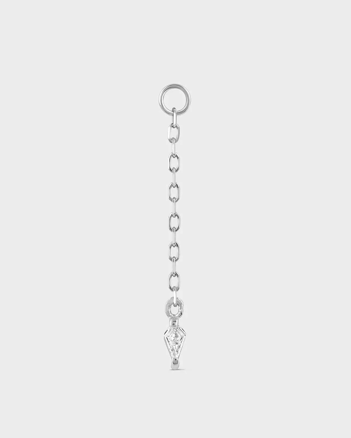 Silver chain with a key-shaped pendant on a light gray background