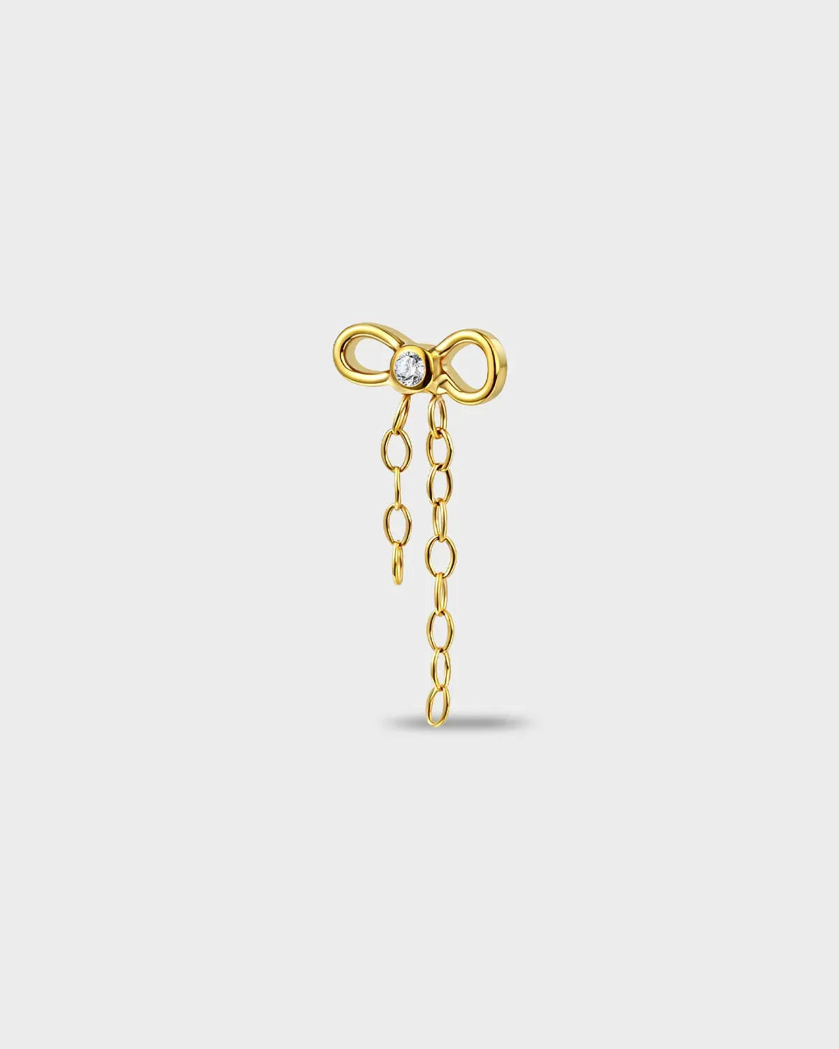 Polished titanium earring with a bow-shaped top set with a clear round stone and a double chain dangle on a light gray background.