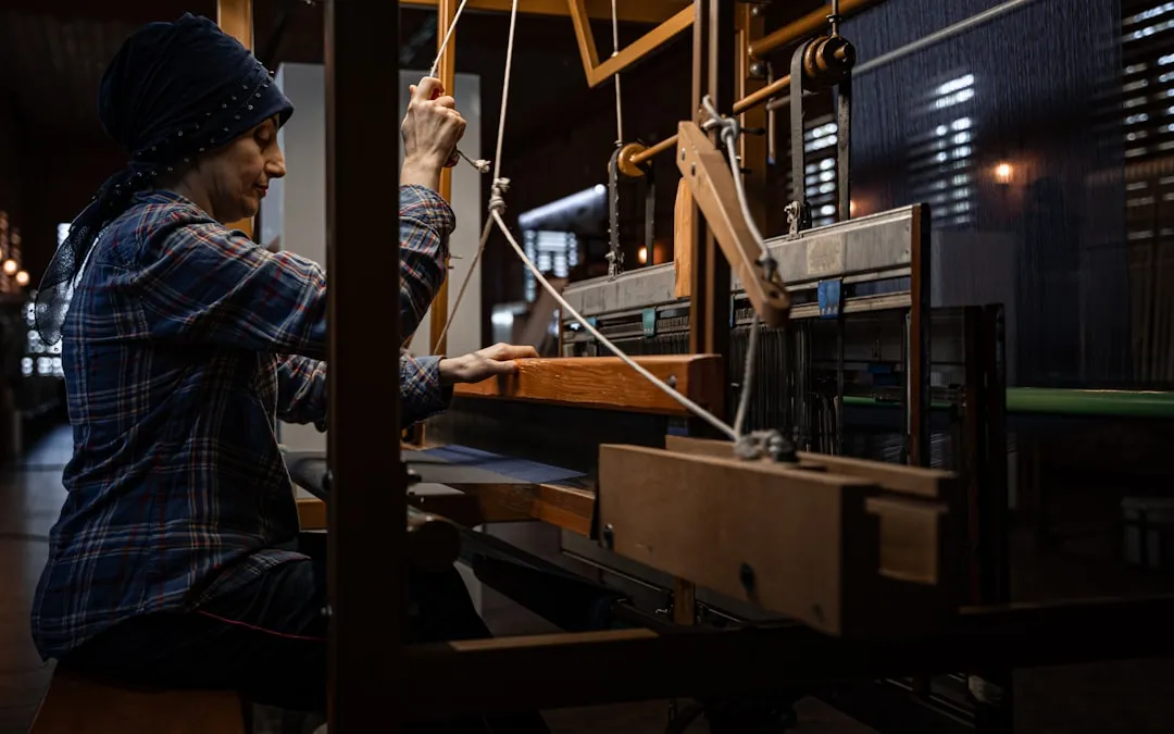 Woman operating a traditional loom