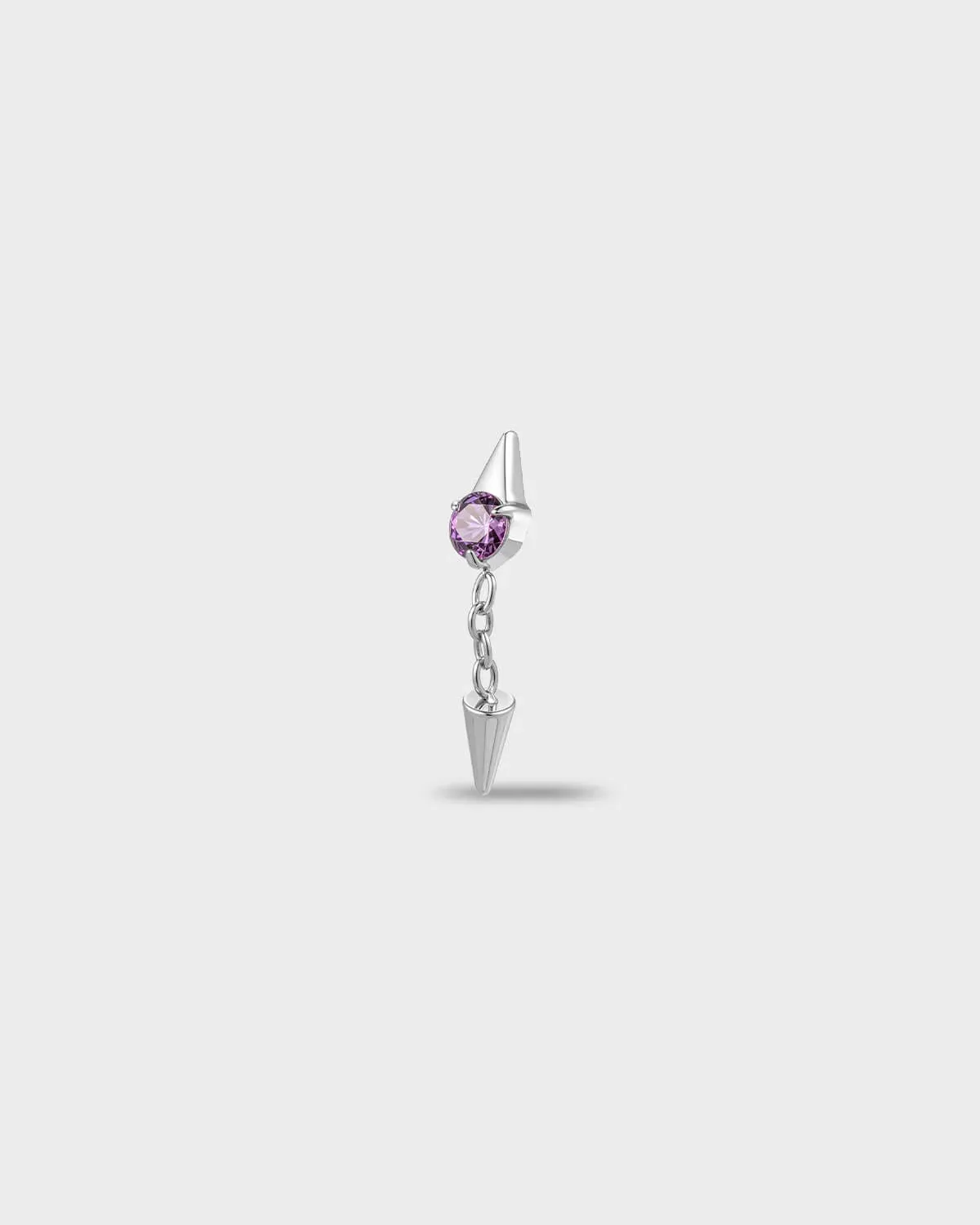 Polished titanium earring with a round-cut amethyst purple stone and a short chain dangle finished with a polished spike, on a light gray background.