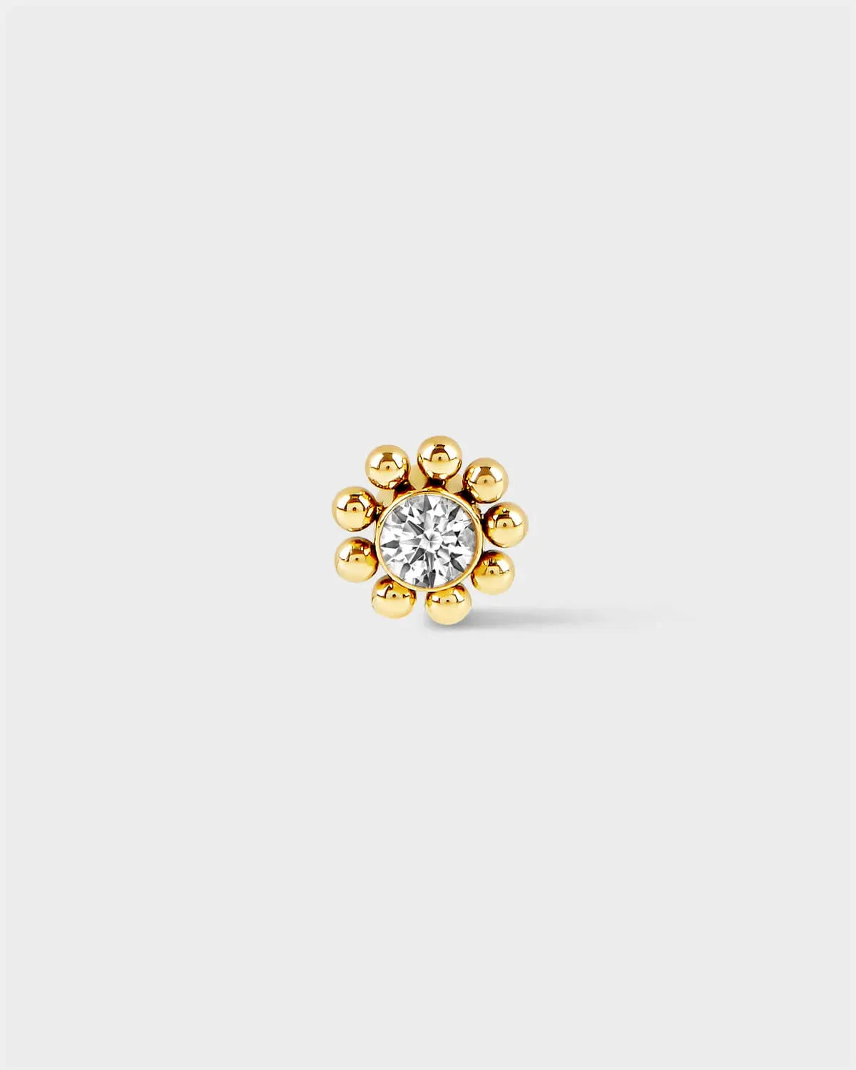 Gold titanium Full beaded solitaire earring on light grey background