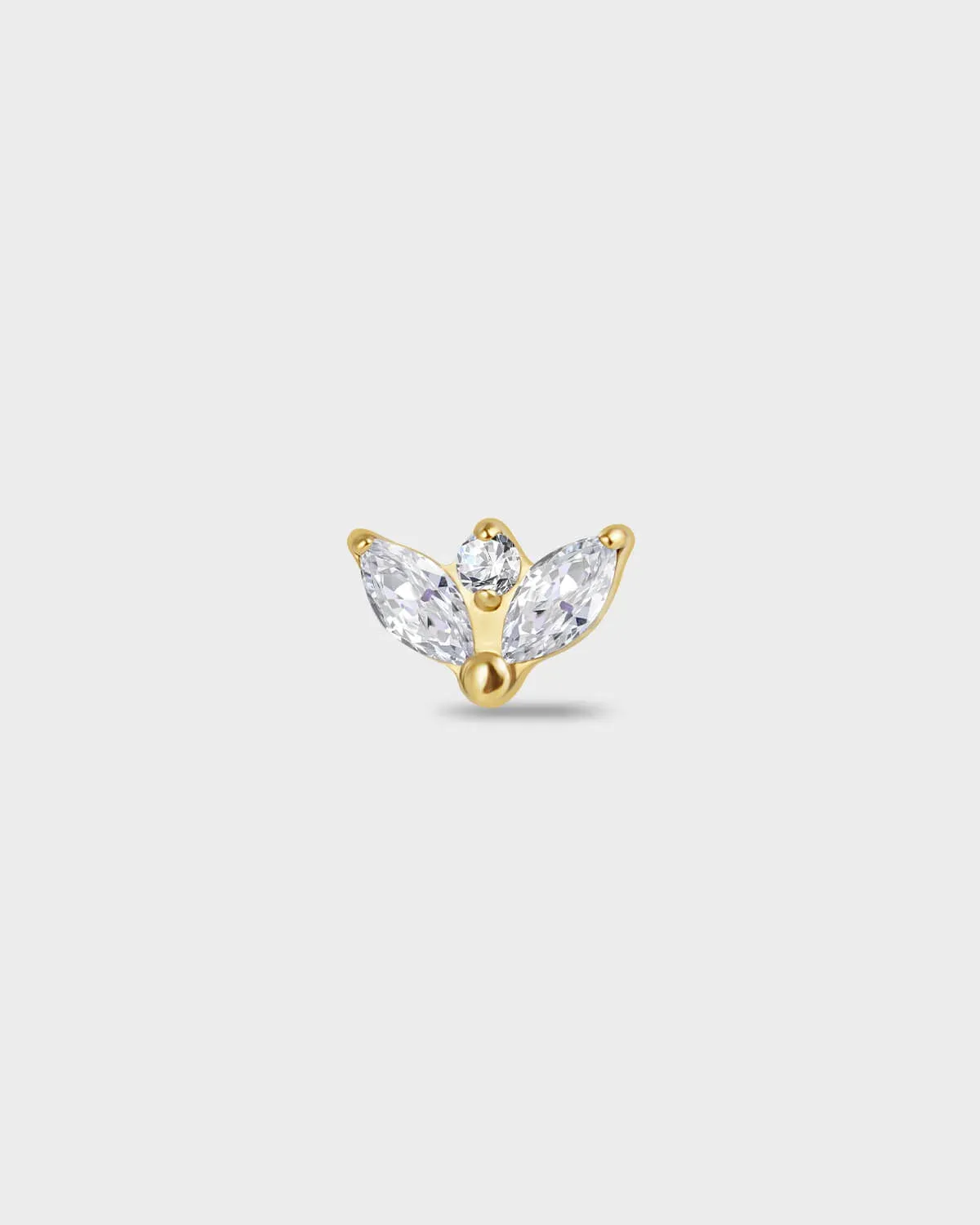 Gold itanium earring with two marquise-cut clear stones set below a single round-cut clear stone on a light gray background.