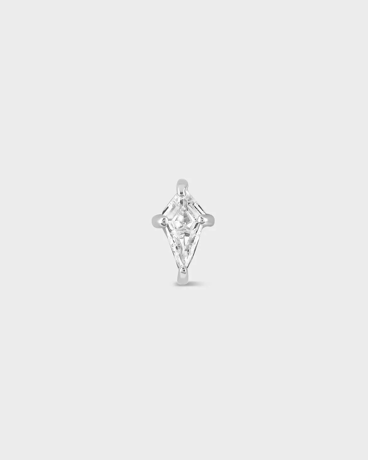Silver and clear kite shape gemstone earring on a light gray background