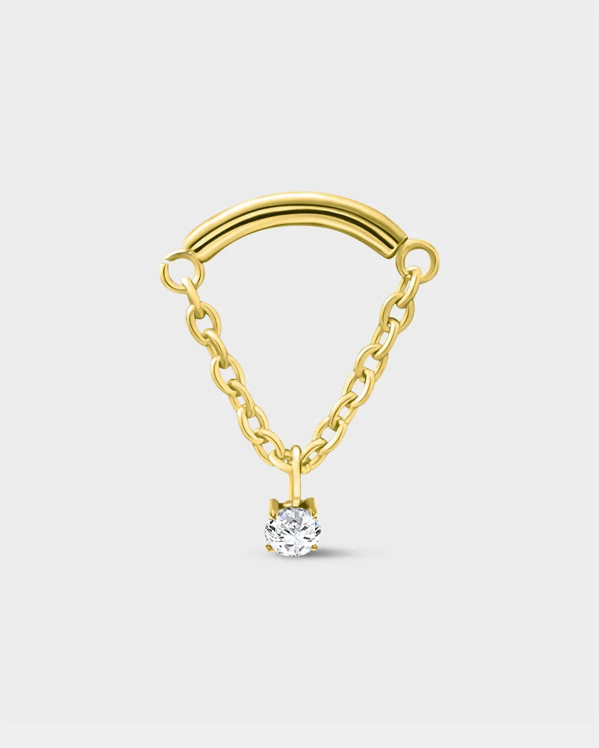 24k gold PVD titanium earring used for hidden helix or hidden rook featuring a smooth curved bar with a chain connected at each end and a single clear solitaire pendent on a light grey background.