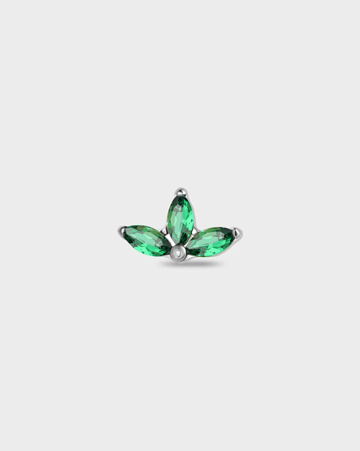 Polished titanium earring with three emerald green marquise gemstones on a light gray background