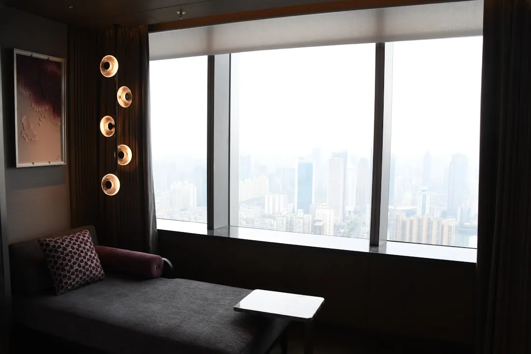Modern lounge area with city view through large window